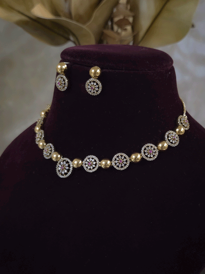 Circular zircon studded tukdies with half gold bead design sleek set