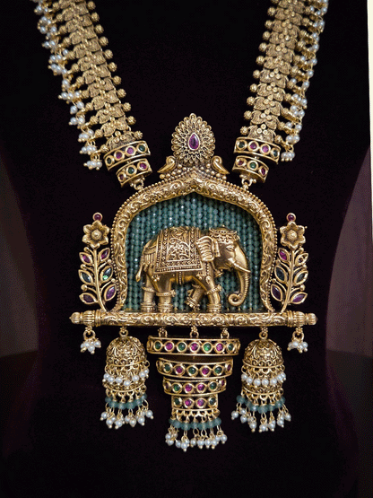 Broad chain with pearly hangings long elephant motif pendant set on beads back