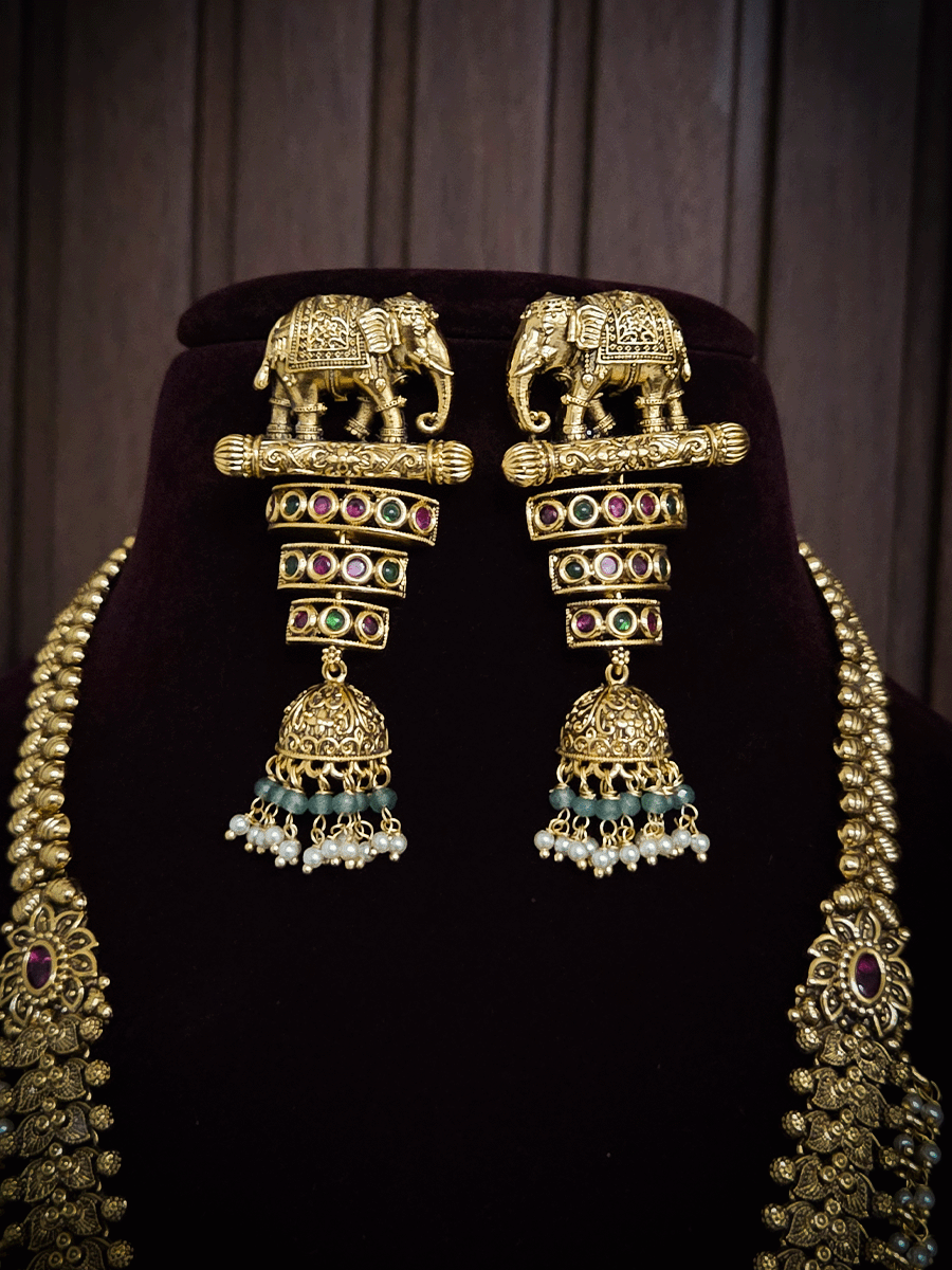 Broad chain with pearly hangings long elephant motif pendant set on aqua beads back