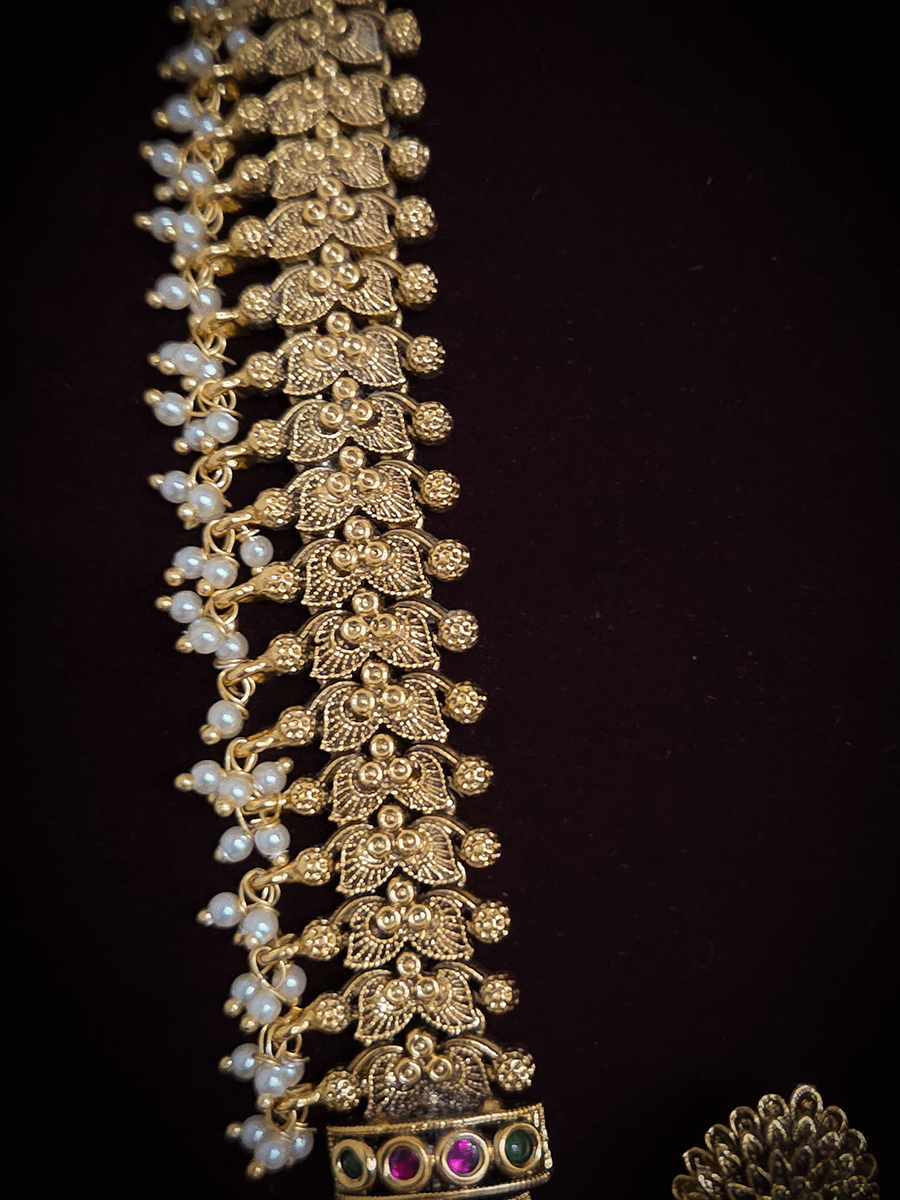 Broad chain with pearly hangings long elephant motif pendant set on aqua beads back