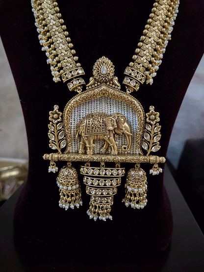 Broad chain with pearly hangings long elephant motif pendant set on beads back
