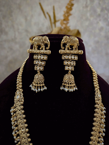 Broad chain with pearly hangings long elephant motif pendant set on beads back