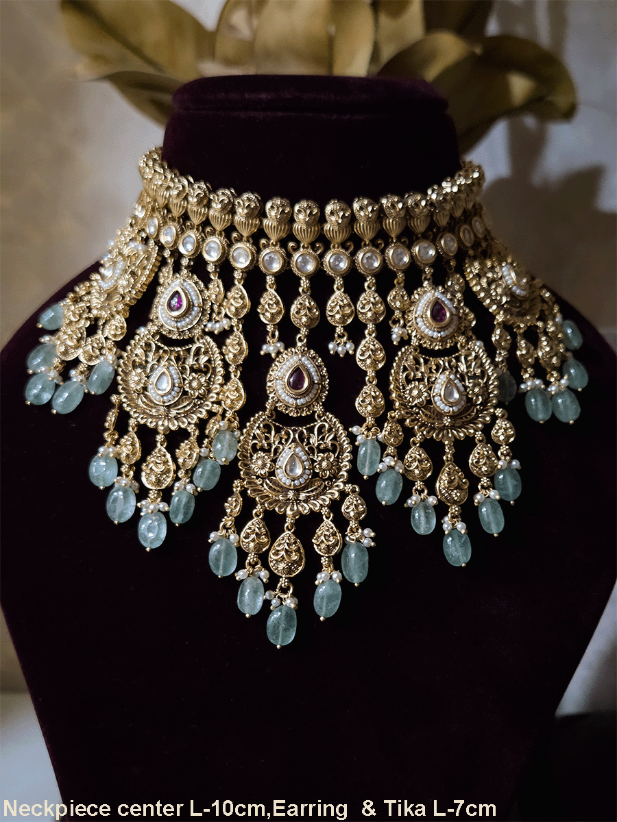 Traditional kundan set with chandbali design tukdies and leaf tassel hangings
