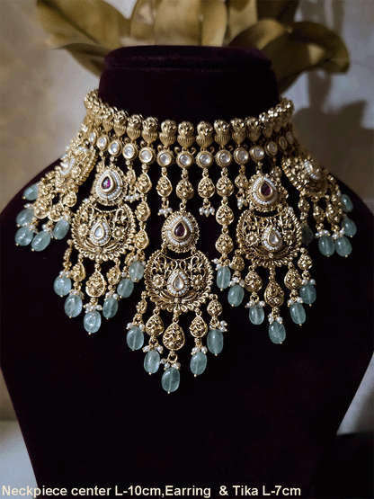 Traditional kundan set with chandbali design tukdies and leaf tassel hangings