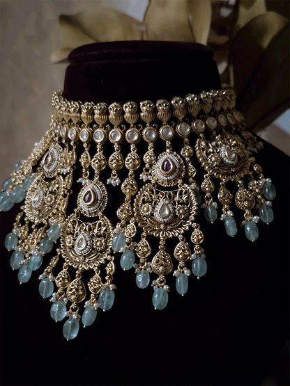 Traditional kundan set with chandbali design tukdies and leaf tassel hangings