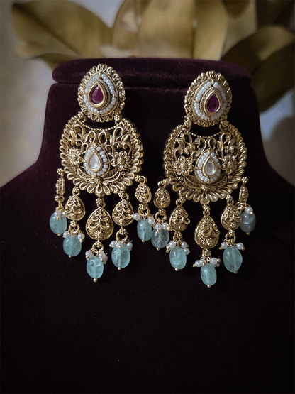 Traditional kundan set with chandbali design tukdies and leaf tassel hangings