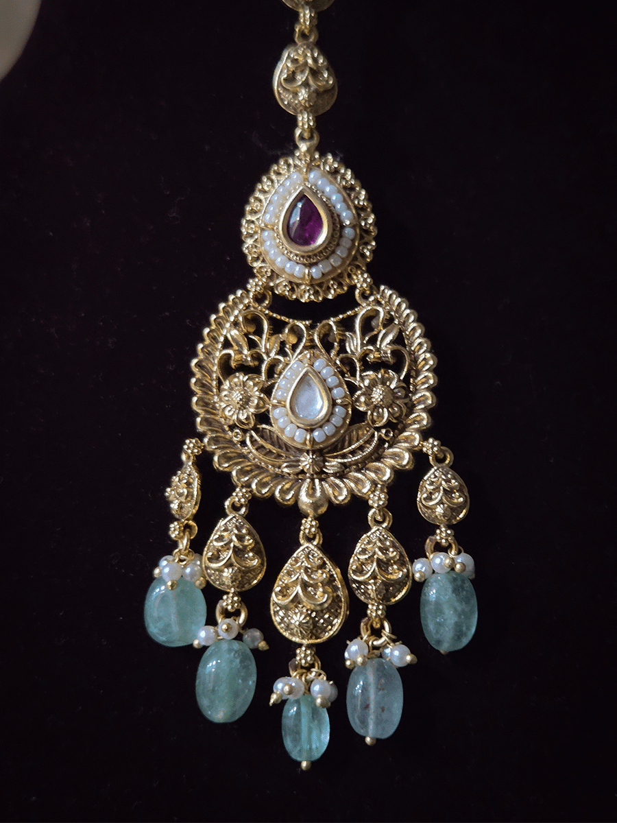 Traditional kundan set with chandbali design tukdies and leaf tassel hangings