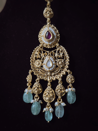 Traditional kundan set with chandbali design tukdies and leaf tassel hangings