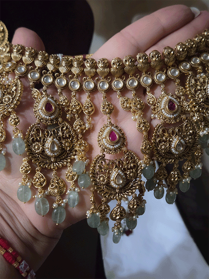Traditional kundan set with chandbali design tukdies and leaf tassel hangings