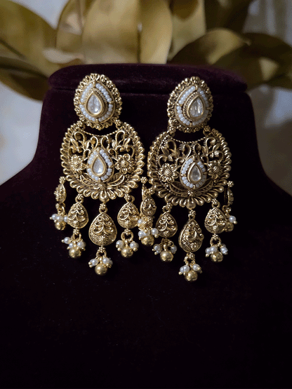 Traditional kundan set with chandbali design tukdies and leaf tassel hangings