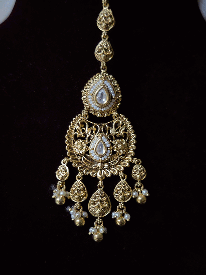 Traditional kundan set with chandbali design tukdies and leaf tassel hangings