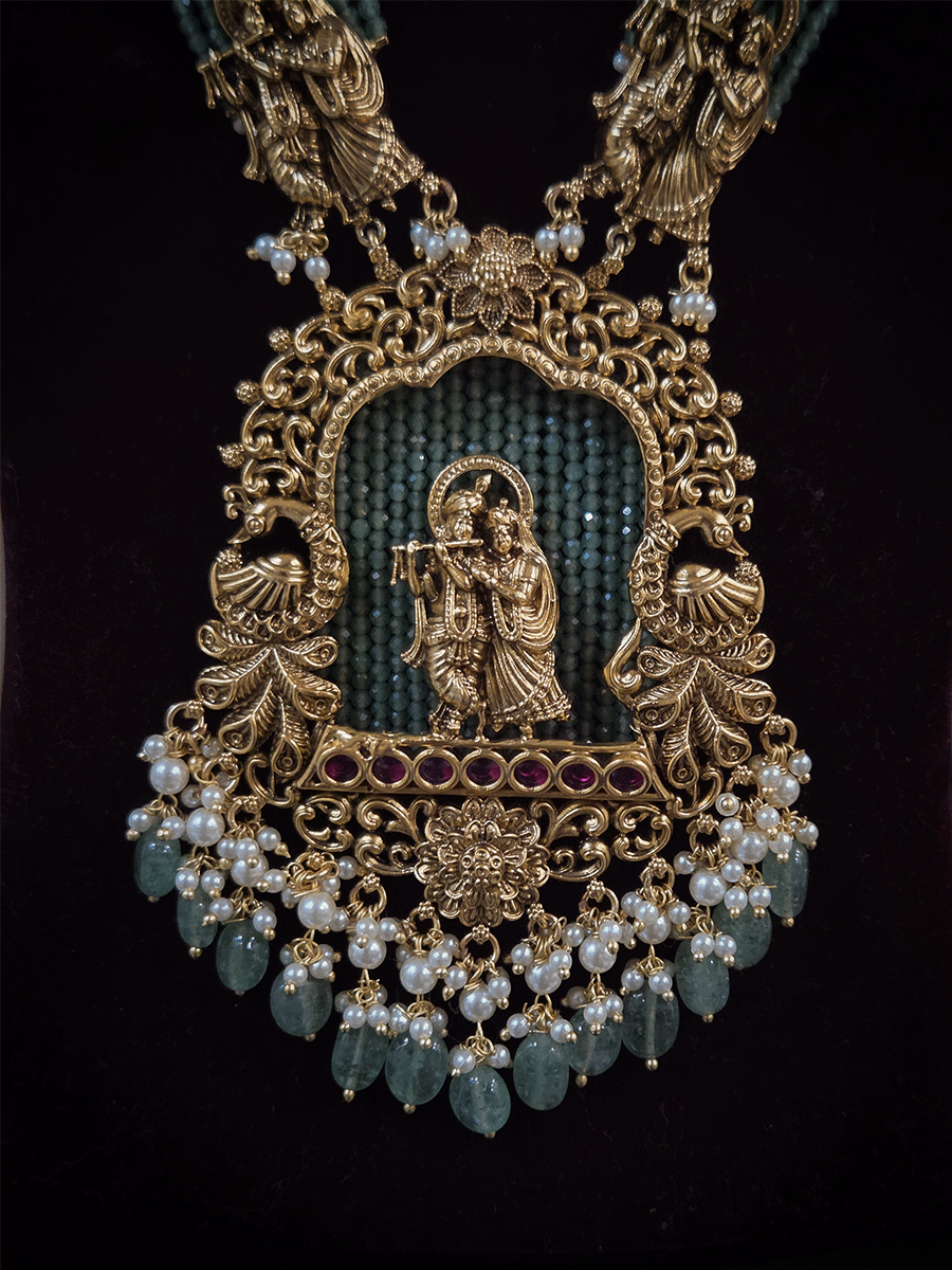 Intricate carving pendant set with Radha Krishna motif in center and Radha krishna motif's on side multiple bead strings