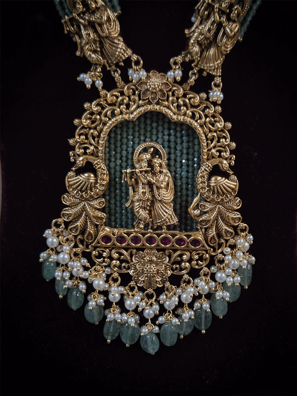 Intricate carving pendant set with Radha Krishna motif in center and Radha krishna motif's on side multiple bead strings