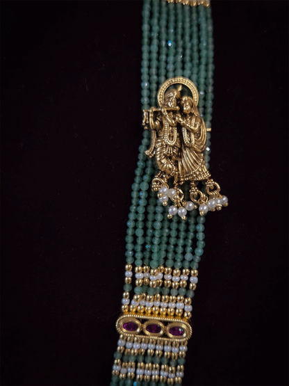 Intricate carving pendant set with Radha Krishna motif in center and Radha krishna motif's on side multiple bead strings