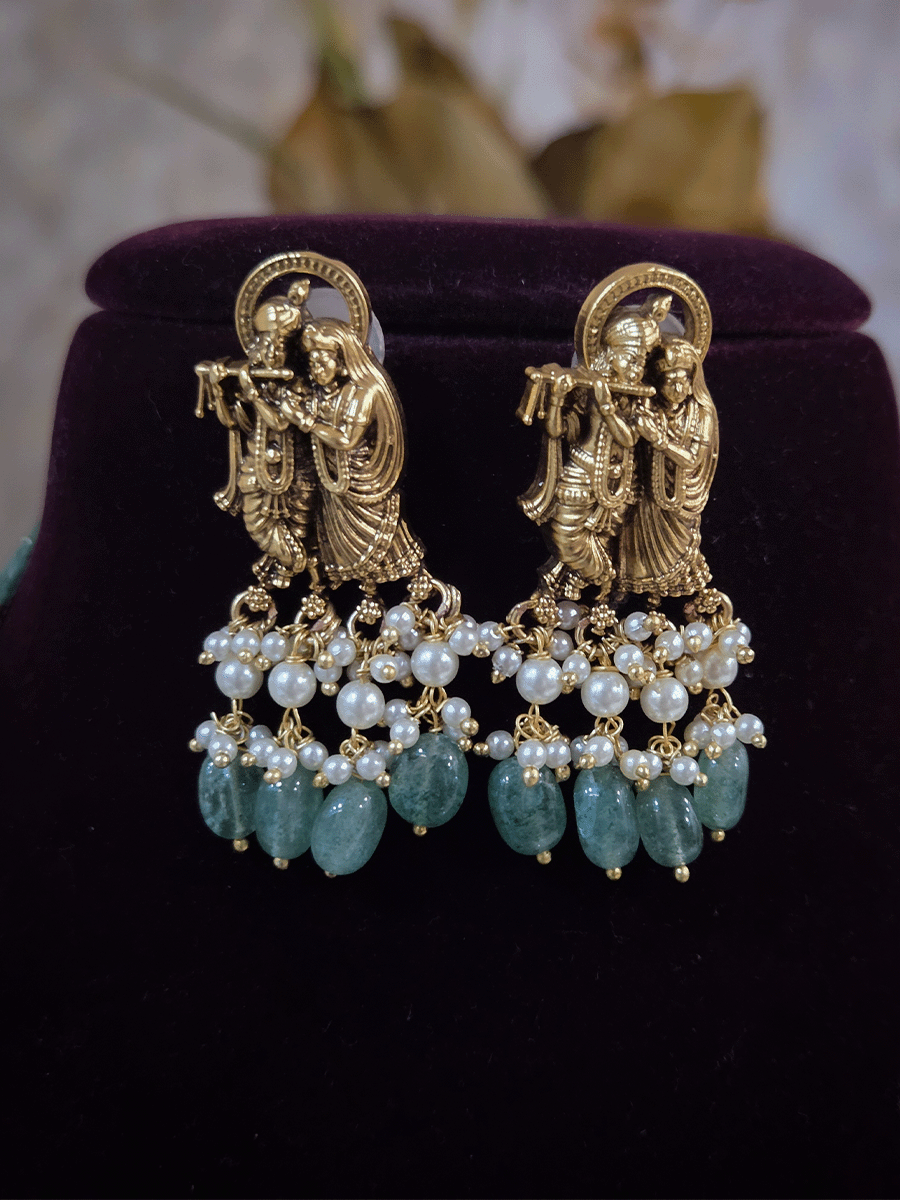 Intricate carving pendant set with Radha Krishna motif in center and Radha krishna motif's on side multiple bead strings