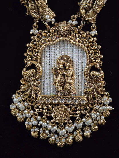Intricate carving pendant set with Radha Krishna motif in center and Radha krishna motif's on side multiple bead strings