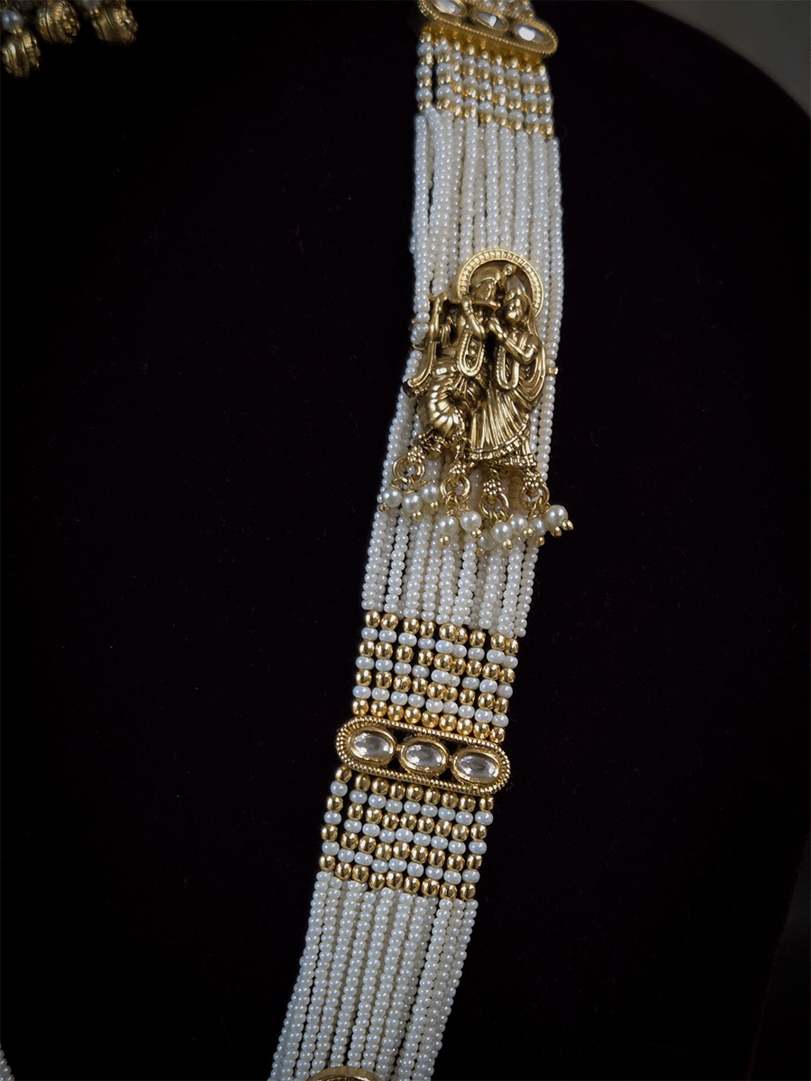 Intricate carving pendant set with Radha Krishna motif in center and Radha krishna motif's on side multiple bead strings