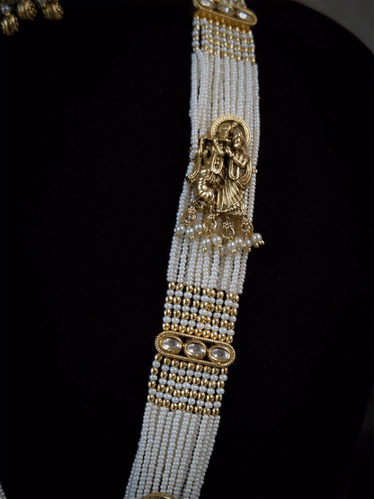 Intricate carving pendant set with Radha Krishna motif in center and Radha krishna motif's on side multiple bead strings