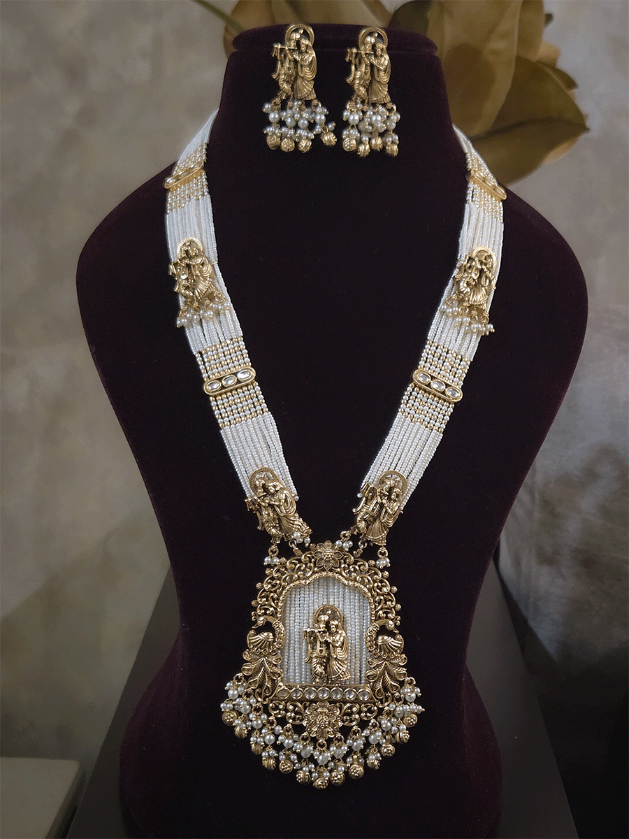 Intricate carving pendant set with Radha Krishna motif in center and Radha krishna motif's on side multiple bead strings