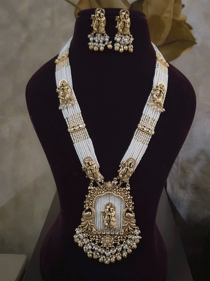 Intricate carving pendant set with Radha Krishna motif in center and Radha krishna motif's on side multiple bead strings