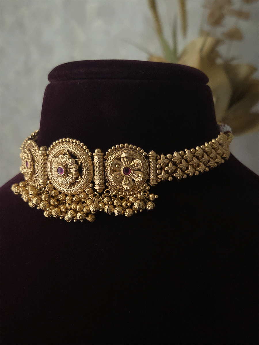 Three ruby stone flowers in circular design set with ghunghru hangings