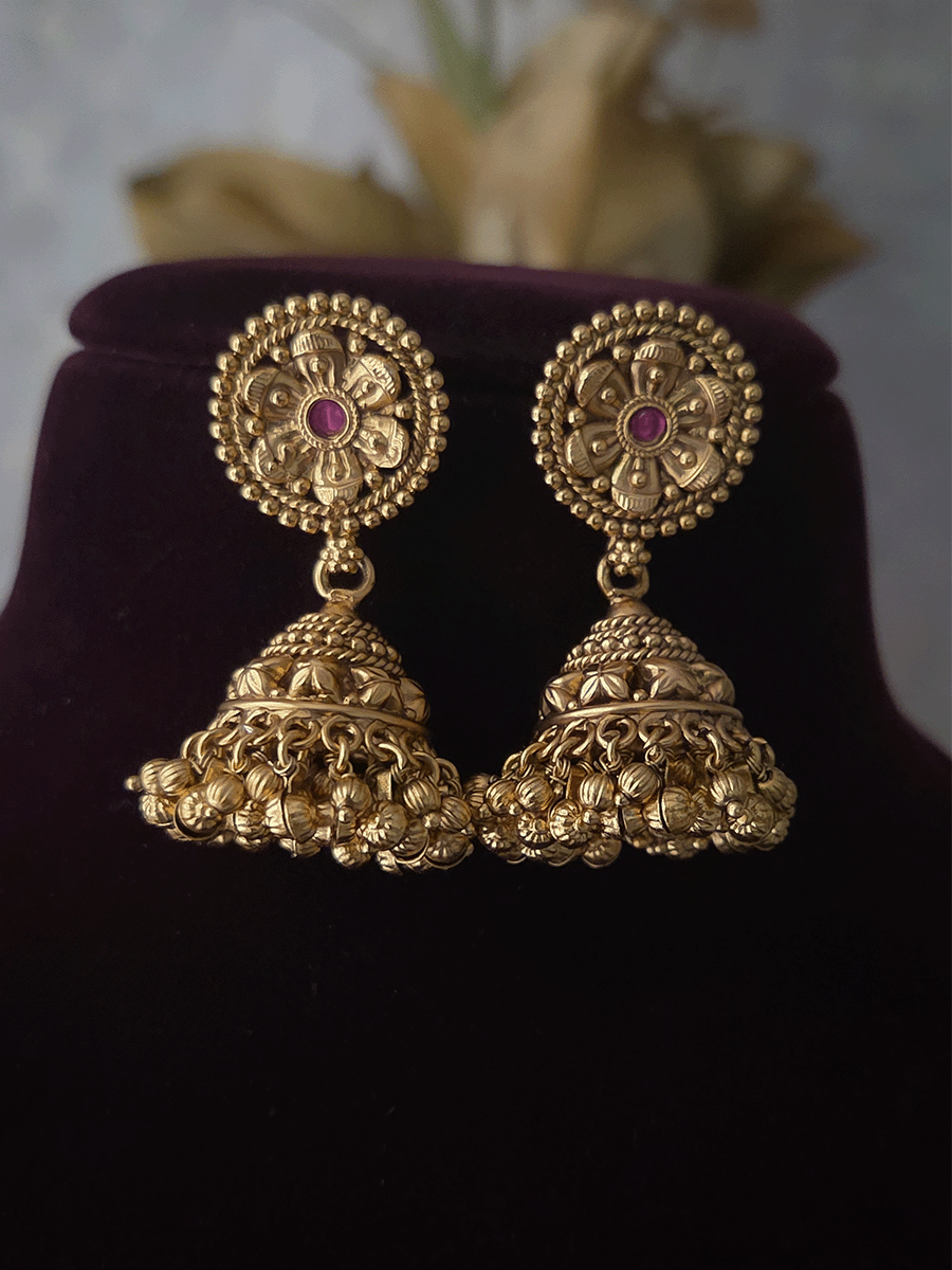 Three ruby stone flowers in circular design set with ghunghru hangings