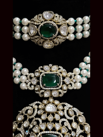 Set of two coloured stones polki studded mehandi finish neckpieces set with three pearl strings(one short and one bold pendant)