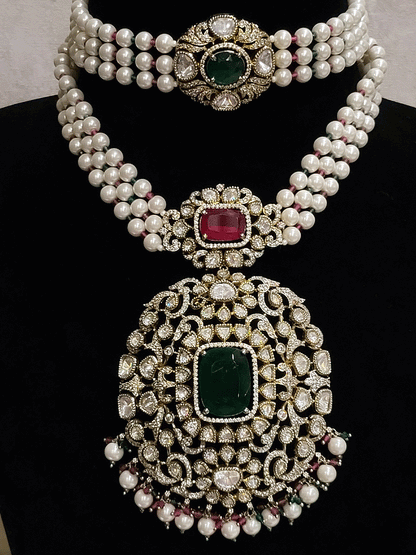 Set of two coloured stones polki studded mehandi finish neckpieces set with three pearl strings(one short and one bold pendant)