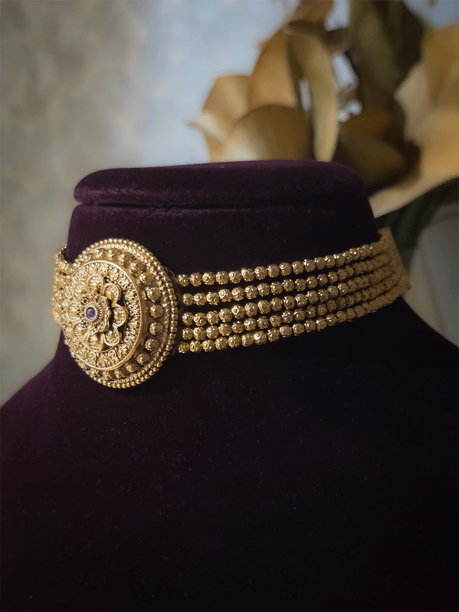 Circular flower design choker set with ruby stone in center and side 5 gold bead chains