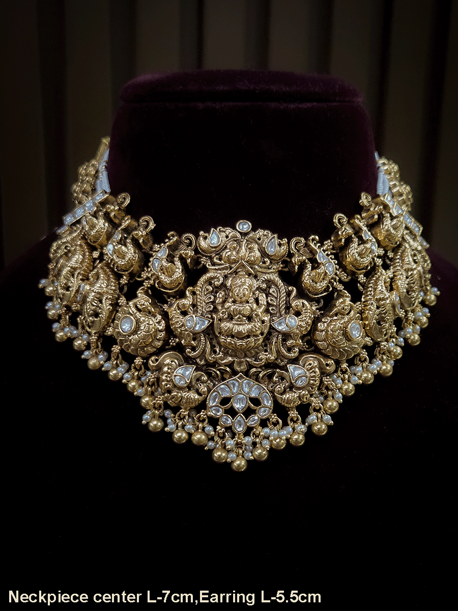 7 cm broad kundan studded laxmi ji choker set with intricately carved peacocks