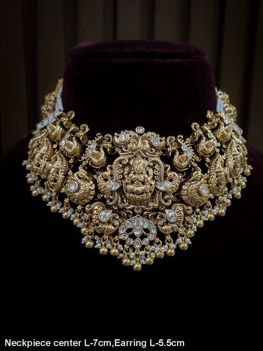 7 cm broad kundan studded laxmi ji choker set with intricately carved peacocks