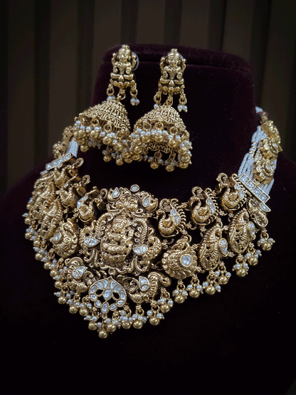 7 cm broad kundan studded laxmi ji choker set with intricately carved peacocks