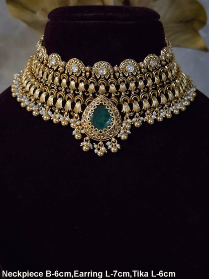 Antique gold finish kundan set with bold tear drop shaped stone in center