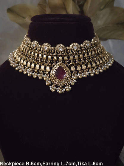 Antique gold finish kundan set with bold tear drop shaped stone in center