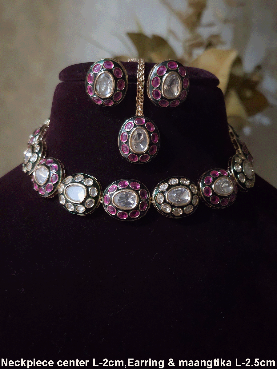 Ruby stones and kundan studded oval green enamel connecting tukdies set
