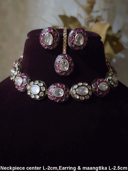 Ruby stones and kundan studded oval green enamel connecting tukdies set