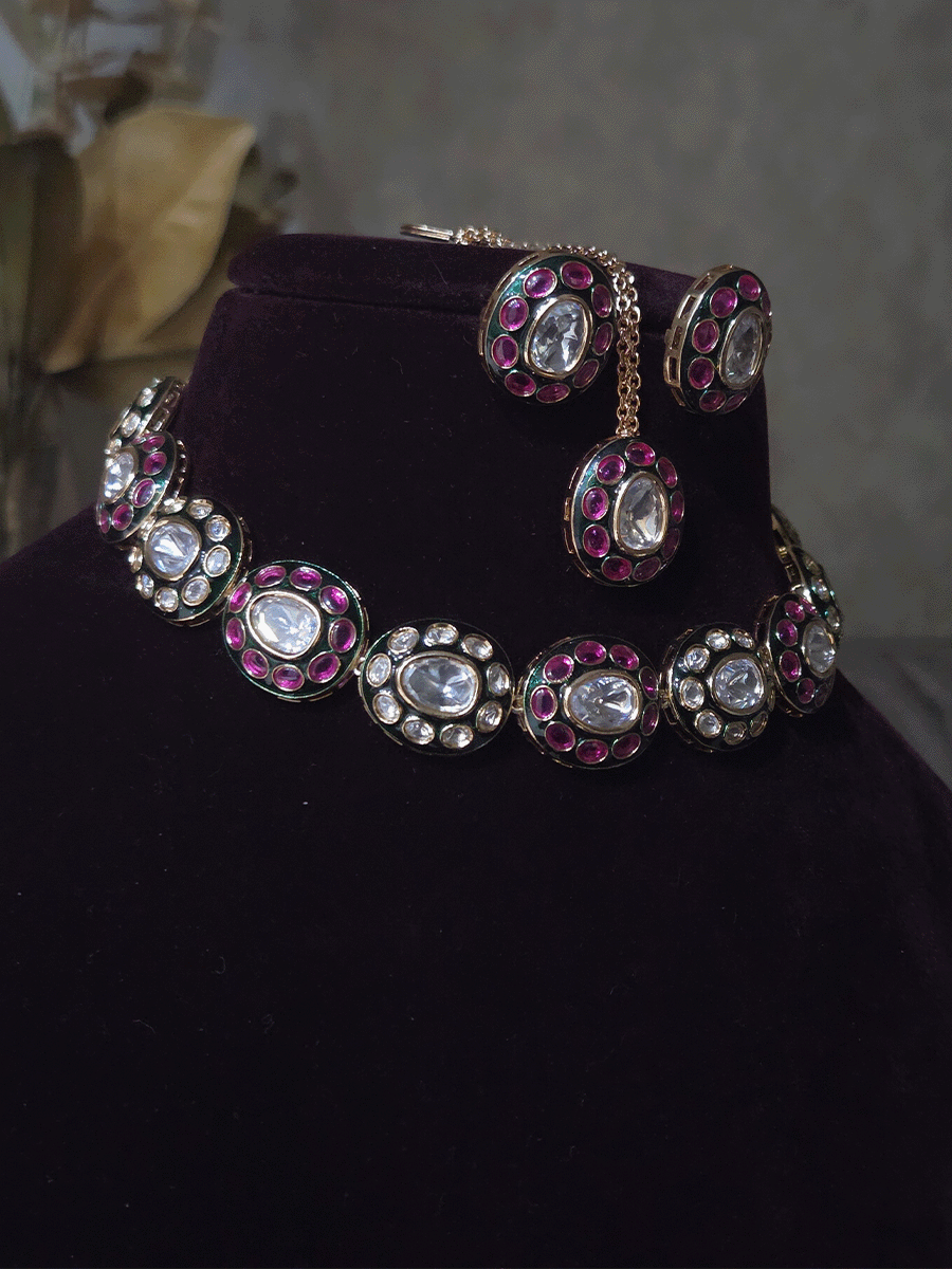 Ruby stones and kundan studded oval green enamel connecting tukdies set