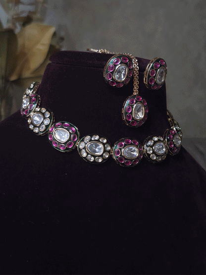 Ruby stones and kundan studded oval green enamel connecting tukdies set