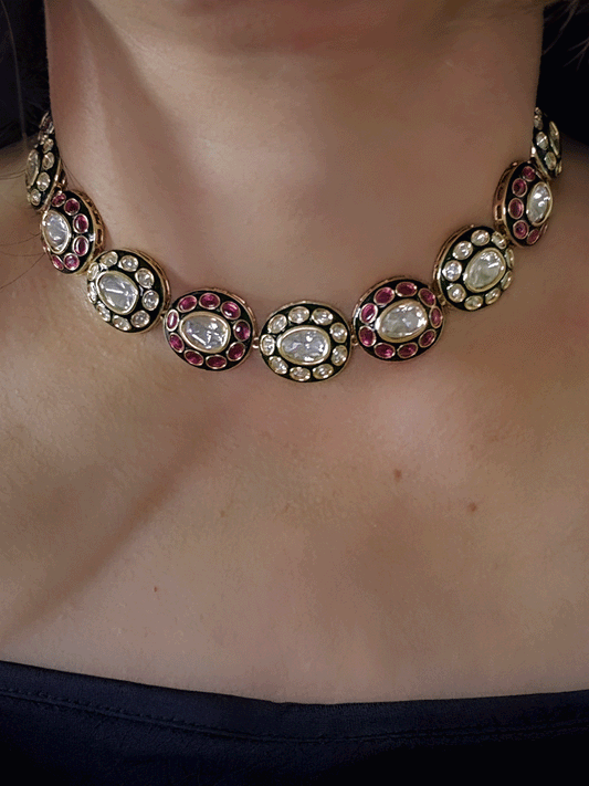 Ruby stones and kundan studded oval green enamel connecting tukdies set