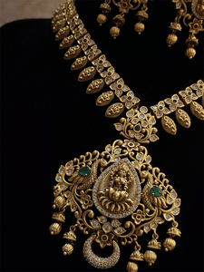 Laxmiji pendant studded with green stones and AD with leaf design string with polki - Odara Jewellery