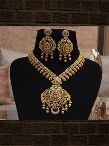 Laxmiji pendant studded with green stones and AD with leaf design string with polki - Odara Jewellery
