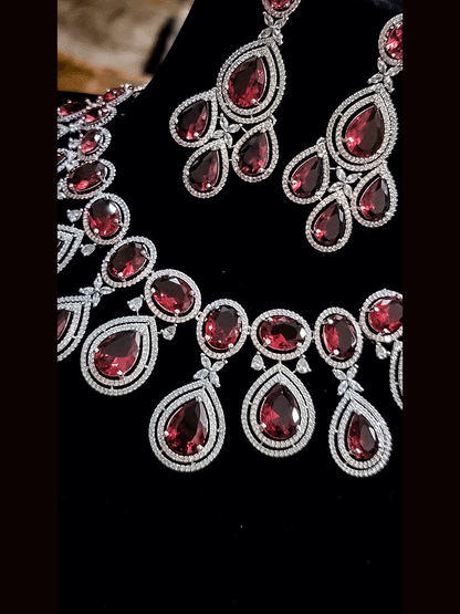 Oval and tear drop shaped stones AD set with AD flower design