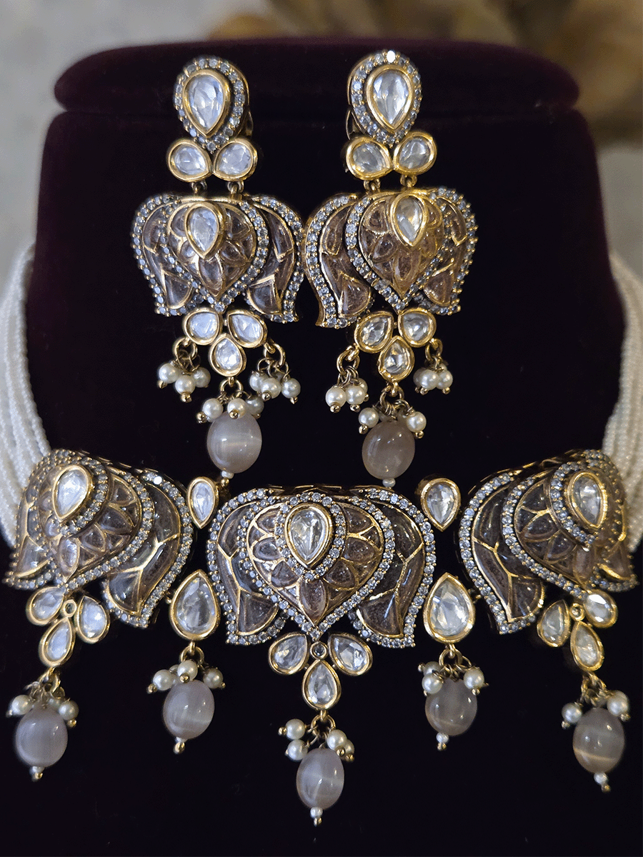 Inverted lotus coloured stones and uncut polki set with side cheed strings and bead drops