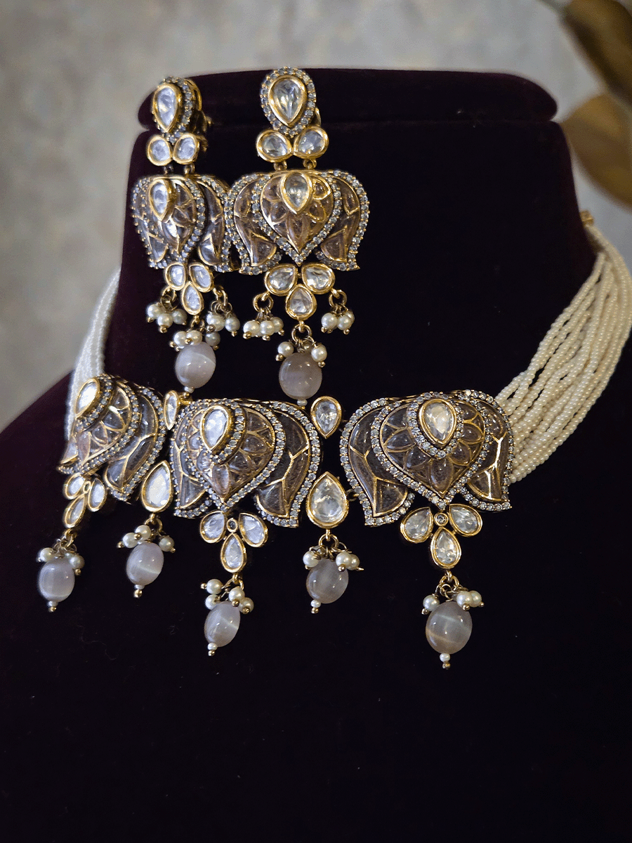 Inverted lotus coloured stones and uncut polki set with side cheed strings and bead drops