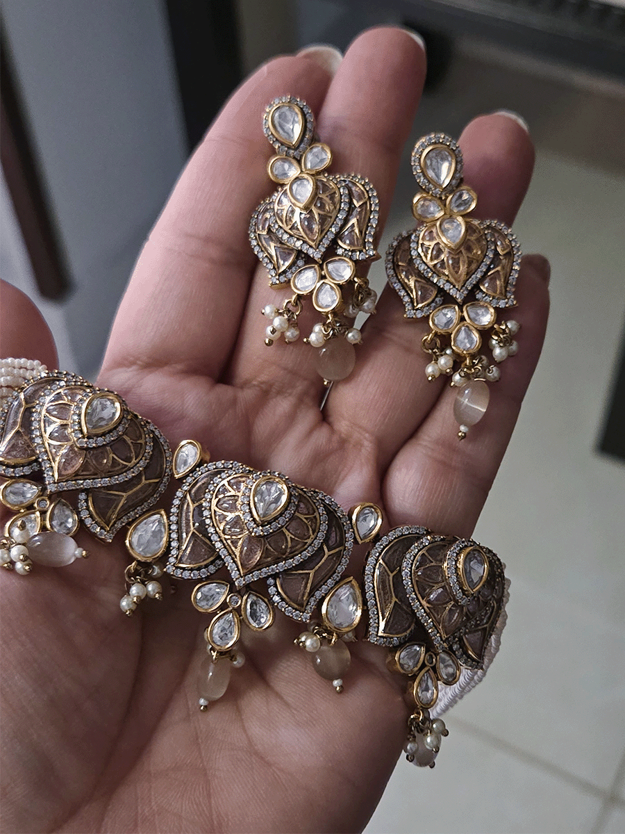 Inverted lotus coloured stones and uncut polki set with side cheed strings and bead drops