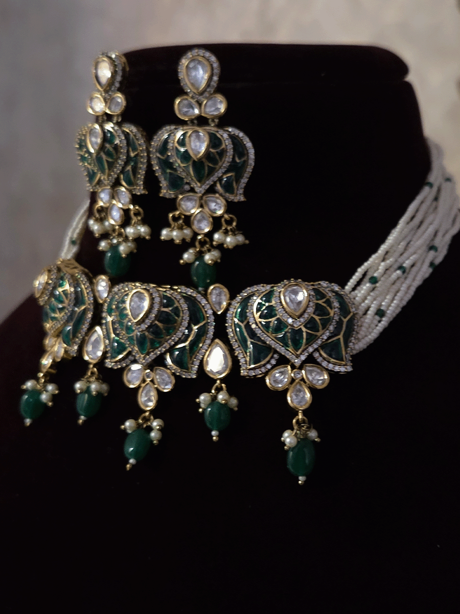 Inverted lotus coloured stones and uncut polki set with side cheed strings and bead drops