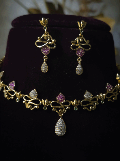 Lotus flower design sleek set with stones studded leaves and tear shaped white stones drop in center