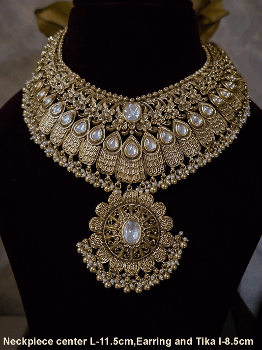 V shaped tear shaped kundan intricately carved set with flower design hanging tukdi in center