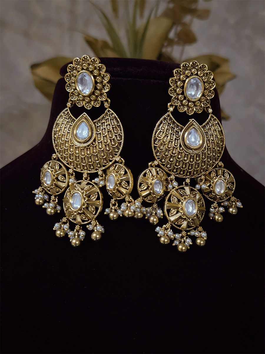 V shaped tear shaped kundan intricately carved set with flower design hanging tukdi in center
