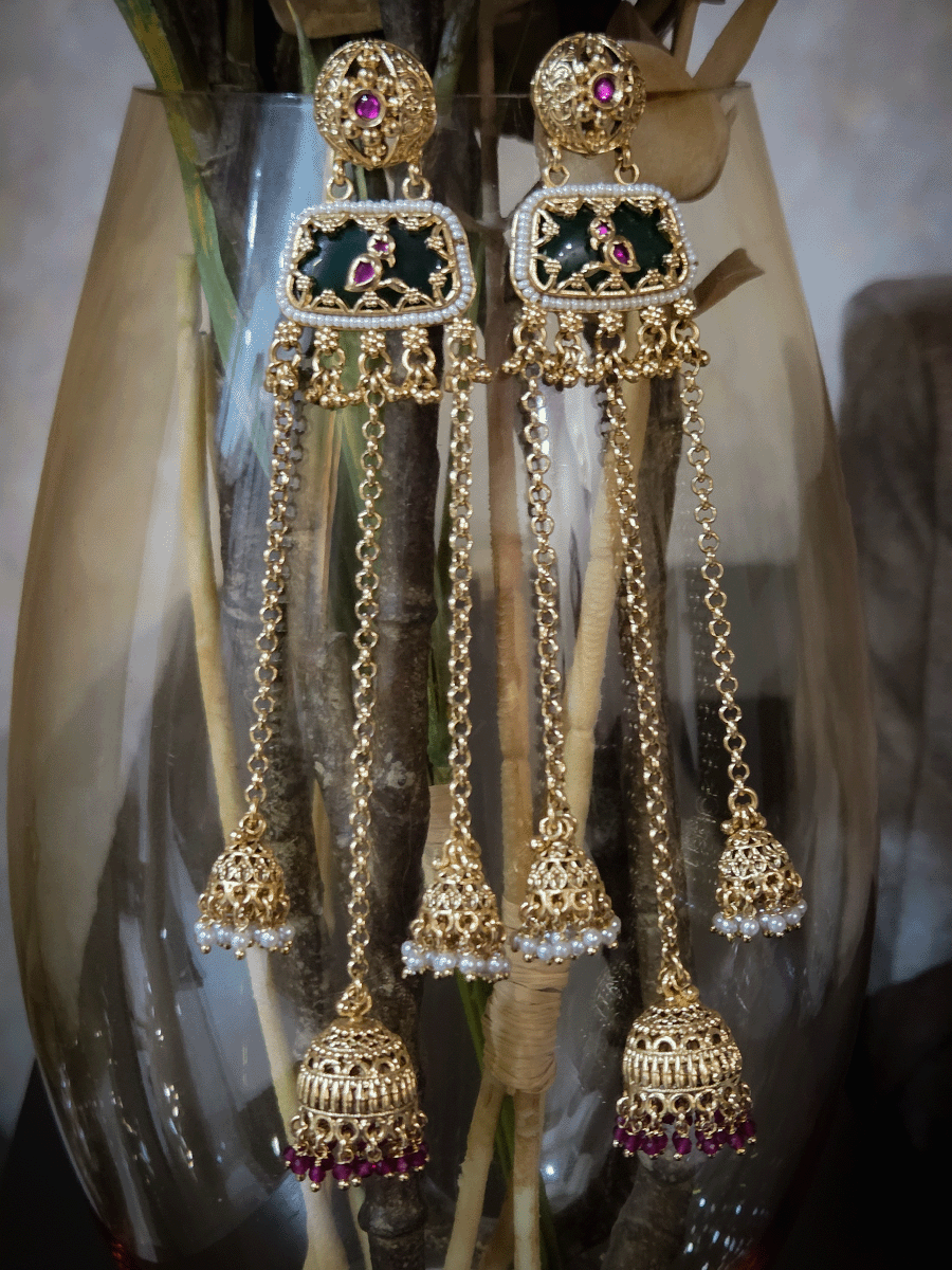 Circular top design with peacock on green stone in middle chain tassels with jhoomki hanging earrings